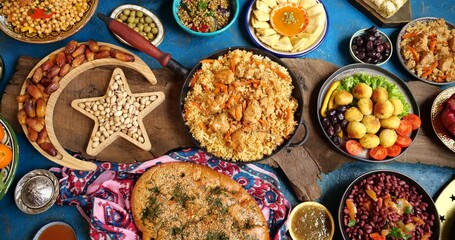 Ramadan Iftar food on the table. Women's hands serve a table for iftar dinner. Traditional Falafel