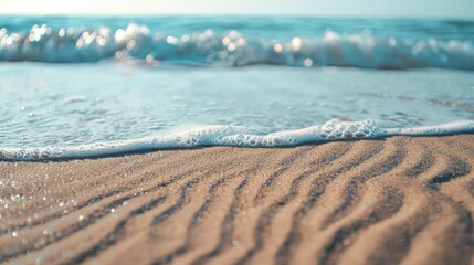 A close up of a sandy beach with waves crashing onto the shore, showcasing the beauty of natures water and wind waves in a natural landscape AIG50