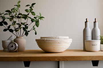 A neatly kitchen counter top with woven baskets.The neutral background highlights the items, creating a harmonious and aesthetically pleasing scene. Baking and cooking concept.