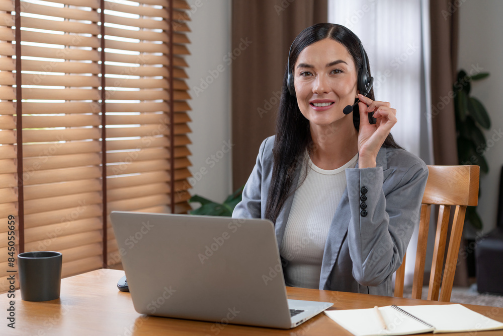 Aufkleber female call center operator or customer service helpdesk staff working on workspace while talking on