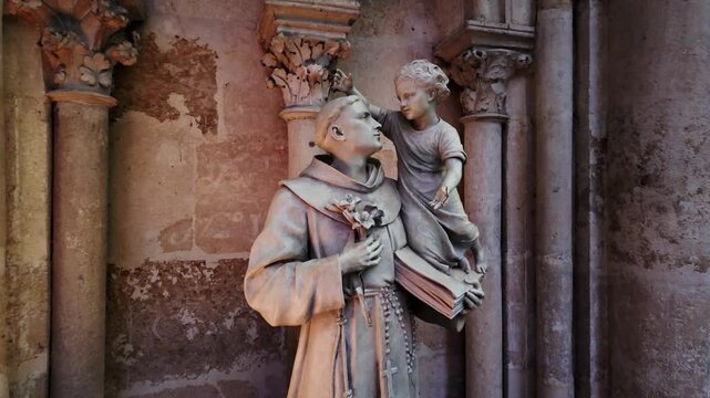 Saint Anthony statue in Saint Julien cathedral, Le Mans, France. Backward shot
