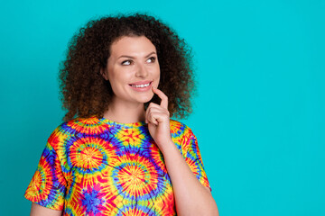 Photo of dreamy cunning charming girl wear stylish colorful print clothes look empty space isolated on cyan color background