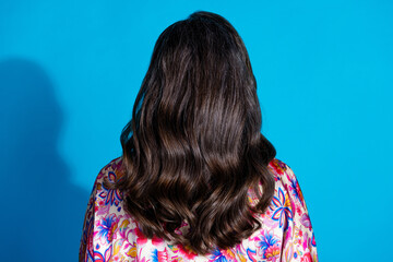 Back view photo of stunning senior woman healthy wavy hair isolated on blue color background