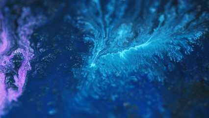 Acrylic paint splash. Sparkling fluid. Defocused blue pink cyan color shimmering glitter particles ink pigment emulsion liquid flow abstract art background.