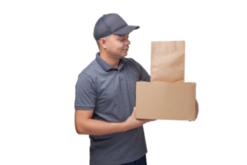 Delivery man holding cardboard box and paper packaging. Delivery concept. Delivery boy concept.