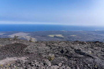Mauna Ulu lava flows 1969 to 1974, Hawaii Volcanoes National Park, The Hilina Pali (cliff) on...