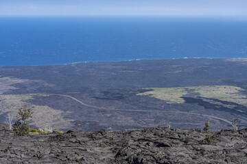 Mauna Ulu lava flows 1969 to 1974, Hawaii Volcanoes National Park, The Hilina Pali (cliff) on...