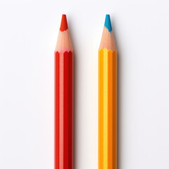 A red and blue colored pencil are displayed on a white background