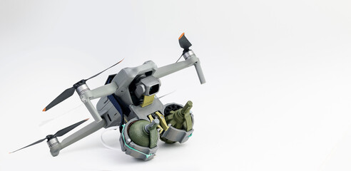 Engineering development for war, army drone with mechanism for dropping grenades on white isolated background. Concept military UAVs using in weapon
