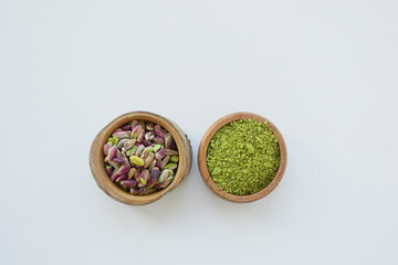 Wooden bowl filled with pistachios, a natural and nutritious superfood
