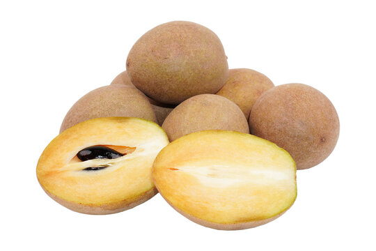 a group of sapodilla fruit and some cuts isolated transparent