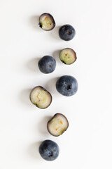 Ripe organic blueberries on white wooden table background. Selective focus.