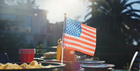 American flag, party and snacks outdoor for barbecue at reunion lunch for national independence day. Nature, terrace and chips on table for United states holiday event in backyard for country pride.