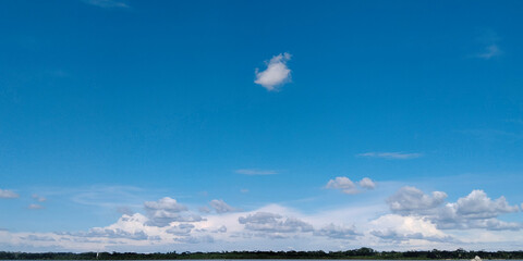 White cumulus clouds in blue sky over sea landscape, big cloud above ocean water panorama, horizon, beautiful tropical sunny summer day seascape panoramic view