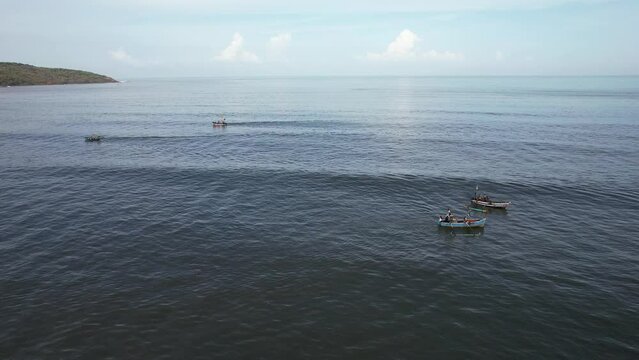 Fishing boats anchored off Ladghar beach at Dapoli, located 200 kms from Pune on the West Coast of Maharashtra India.