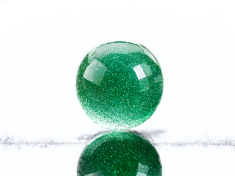 Aventurine A shimmering green aventurine with a glittery sparkled surface floating against a soft focus