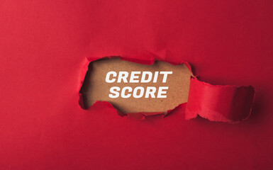 A red background with a white word that says credit score
