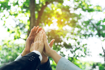 Group of volunteer people joining for cooperation about global community teamwork with join hand together, World environment day, sustainable development goal.