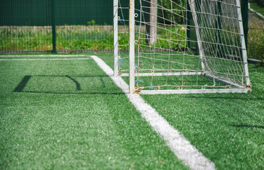 soccer field with goal. Football goal on a football field in sunlight. selective focus.