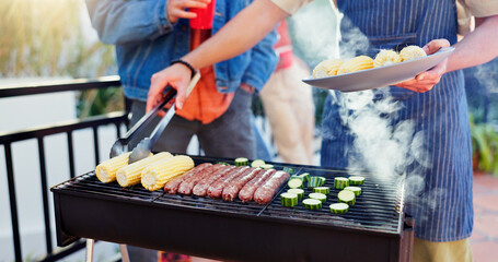 Barbecue, outdoor and friends with sausage and vegetables in backyard for meal at reunion, social event or lunch. Grill, party and men cooking meat and produce for bbq dish on weekend at home.