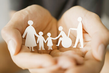Hands holding diversity family, happy carer and volunteer, disable nursing home, rehabilitation and...