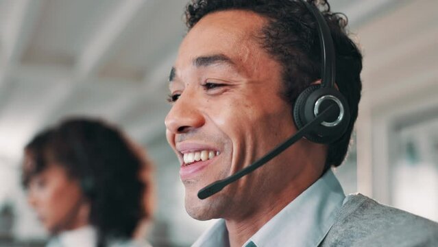 Happy man, consultant and typing with headphones in call center, customer service or telemarketing at office. Male person or agent talking with mic on computer for online advice or help at workplace