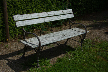 Park bench in a nostalgic look made of cast iron and wood as a symbol of peace and contentment...