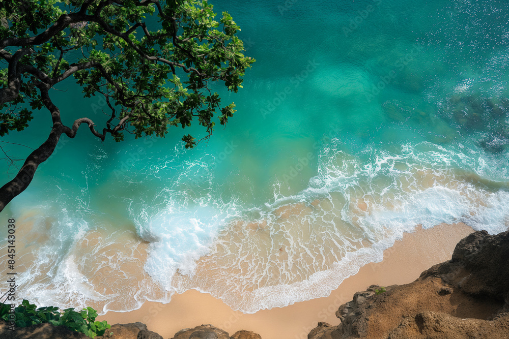 Wall mural aerial view of a pristine beach with turquoise waters and lush green foliage. serene coastal scenery - Wall murals