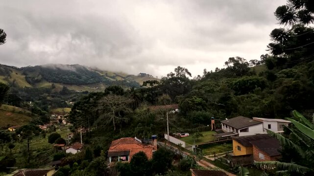 Timelapse of beautiful countryside in Delfim Moreira, Bairro do Ros&aacute;rio, Brazil. Housing near wild nature, forests and mountains. fresh air in the rural area.