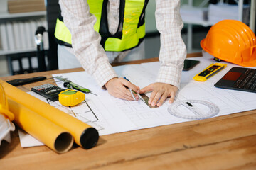 Close up of business people having consultation about wind energy at company office. on architectural project site