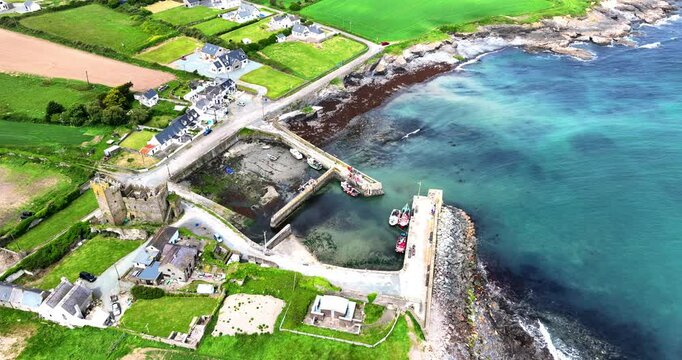 Wexford Epic Locations drone vista of Slade fishing harbour,shelter from the sea on Hook Head Peninsula on a sunny day in summer in Ireland