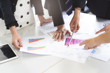 Close up shot business people team meeting in conference room in company. Businessman pointing pen at document on the table.