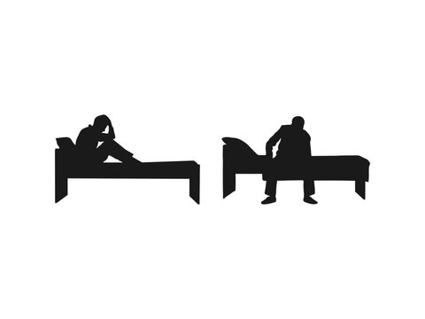 silhouette of a depressed man sadly sitting on the bed in the bedroom. sad man sitting on a single bed isolated on a white background.