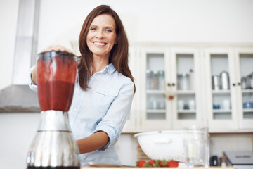 Woman, portrait and blender in kitchen for smoothie or milkshake, handmade and fresh recipe for breakfast detox diet. Girl, strawberry and home for meal alternative, vitamin boost and natural protein