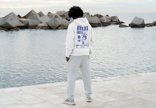 Mockup of man wearing customizable hoodie, rear view