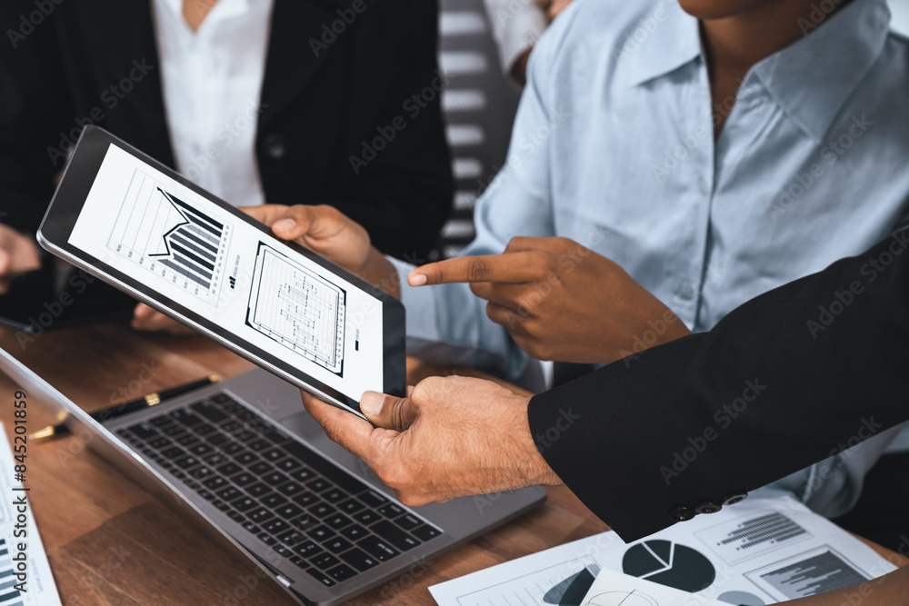 Poster multiracial analyst team use bi fintech software to analyze financial data on meeting table. financi