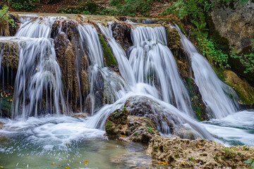 Fototapeta premium Generative ai on theme of beautiful majestic waterfall in natural nature, national park attraction
