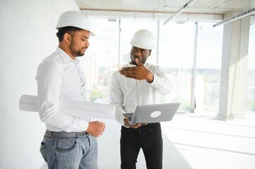 Group of multi ethnic engineer construction site worker meeting at workplace