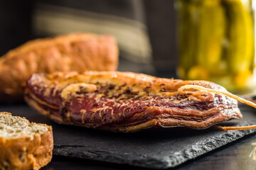 Smoked and Cured Pork Belly With Caraway Seeds on Cutting Board.