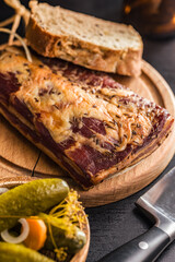 Smoked and Cured Pork Belly With Caraway Seeds on Cutting Board.