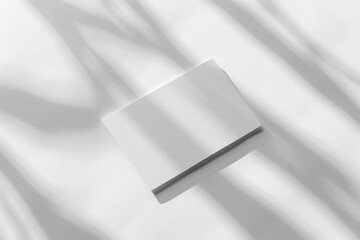 Business card mockup floating on a white paper background, minimalistic and modern design