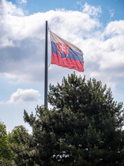 The flag of the Slovak Republic consists of three stripes (white-blue-red tricolor), of the same length placed below each other, and the Slovak coat of arms.