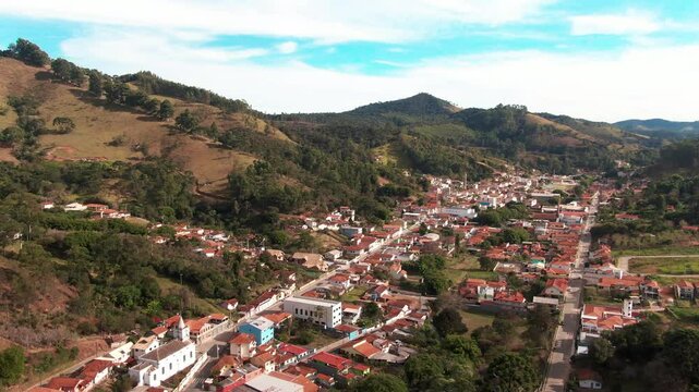A scenic aerial view of Delfim Moreira, a picturesque town nestled in the mountains of Minas Gerais, Brazil.