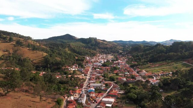 Discover the charming town of Delfim Moreira in Minas Gerais, Brazil, surrounded by breathtaking mountain scenery amid houses and town city