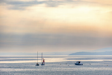 Seascape view with boats on the sea in morning light