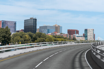 Fototapeta premium Empty urban asphalt road exterior with city buildings background. New modern highway concrete construction. Concept of way to success. Transportation logistic industry fast delivery. Boston. USA.