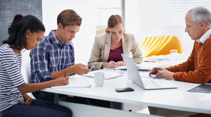 Collaboration, teamwork and support for people in office with laptop and notes for planning, writing and strategy. Diverse, colleagues or employees at desk with tech for meeting, training or research