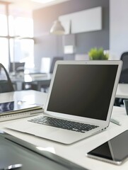 Fototapeta premium Modern white office working space with notebook laptop computer mockup