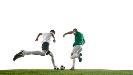 Player in green attempts to block player in white, who kicking ball on green lash playground against white background. Concept of professional sport, championship, final match, movement. Ad