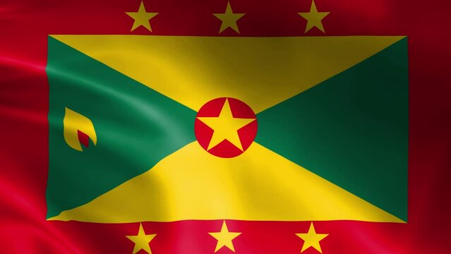 Grenada flag in the wind. Detailed fabric texture.